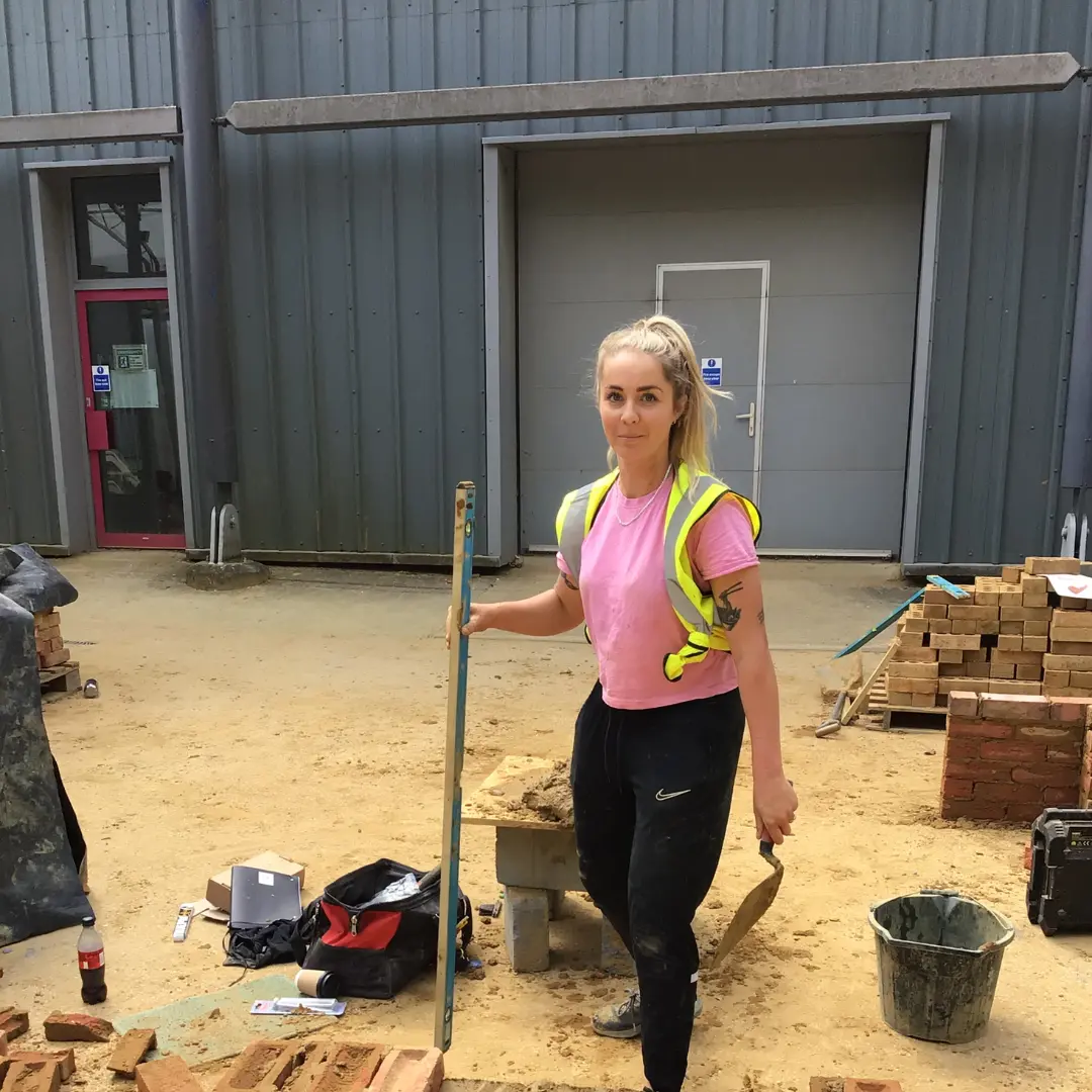 Student levelling bricks